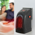 Mini-radiateur portable 400 W branché sur une prise